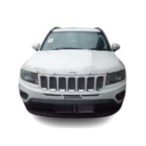 2015 Jeep Compass 2.0 being stripped for spare parts, showing dismantled engine, body panels, interior components, and mechanical parts.