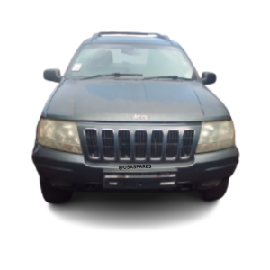 2001 Jeep Grand Cherokee 4.7 WJ being stripped for spares, showing engine components, body panels, interior parts, and suspension ready for resale.
