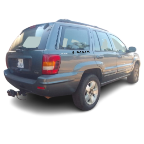 2001 Jeep Grand Cherokee 4.7 WJ being stripped for spares, showing engine components, body panels, interior parts, and suspension ready for resale.