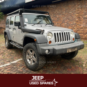 2010 Jeep Wrangler 3.8 Rubicon being stripped for spares with engine, drivetrain, suspension, body panels, and interior components removed and prepared for resale and off-road vehicle repairs.