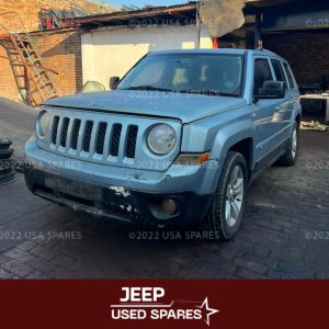 Image of 2014 Jeep Patriot 2.4 Manual Petrol stripping for spares, showing dismantled vehicle components including engine parts, suspension, body panels, and interior items available for resale.
