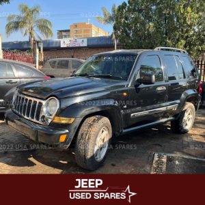 Image of 2005 Jeep Cherokee 3.7 KJ Automatic Petrol stripping for spares, showing dismantled vehicle components including engine parts, suspension, body panels, and interior items available for resale.