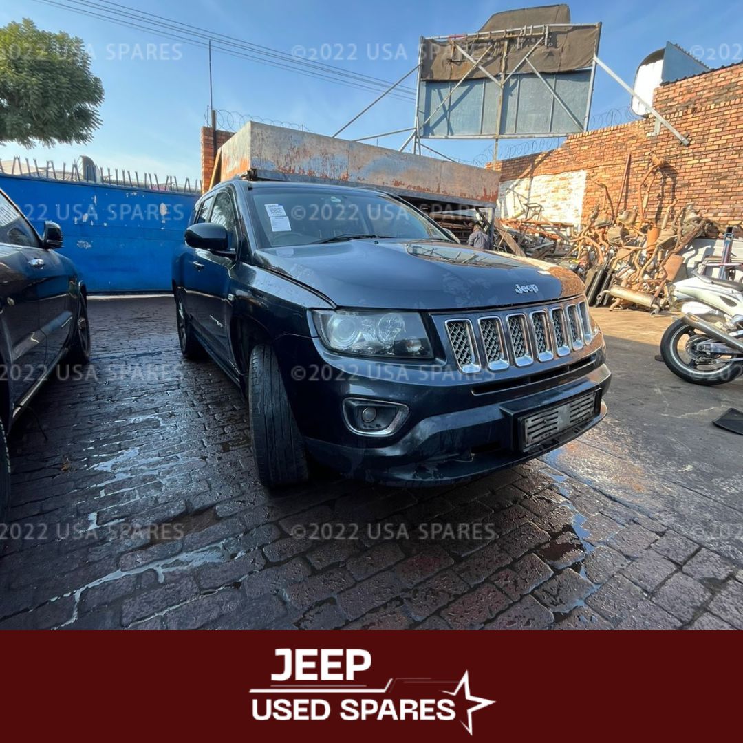 Image of 2014 Jeep Compass 2.0 Manual Petrol stripping for spares, showing dismantled vehicle components including engine parts, suspension, body panels, and interior items available for resale.